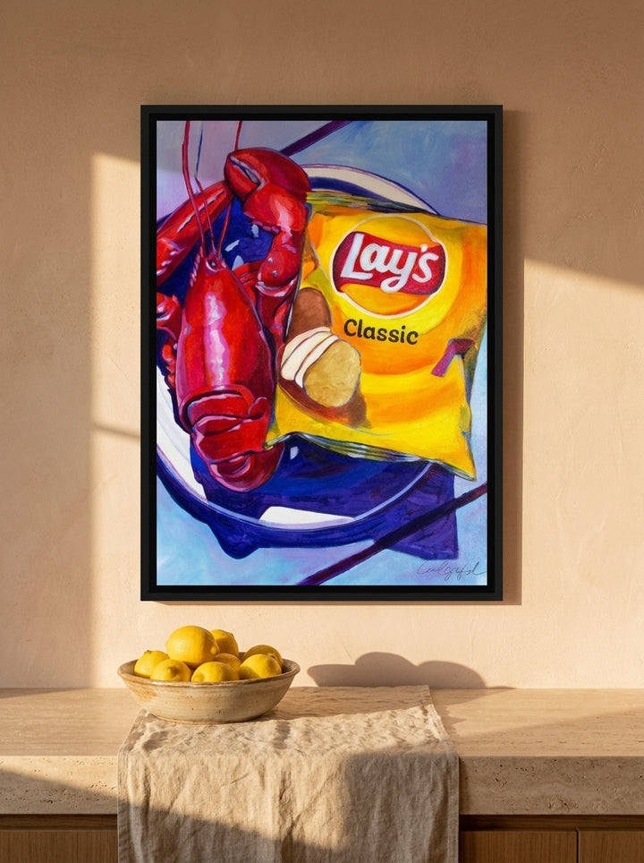 Canvas wall art with a black surround styled on the wall in a Mediterranean kitchen