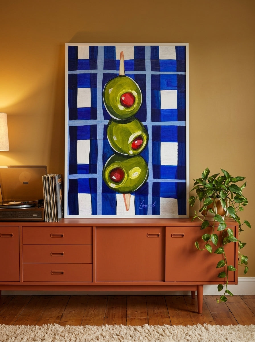 Modern wall art print standing on a sideboard in a retro 70s dining room
