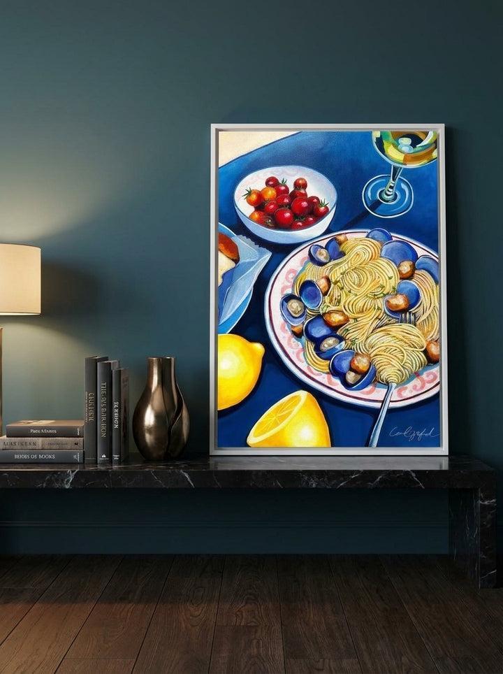 Canvas wall art with a white surround standing on a kitchen bench in a moody kitchen
