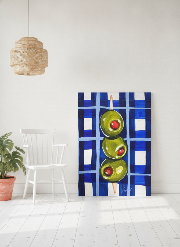 Stretched canvas wall art leaning against the wall in a bright Scandinavian living room