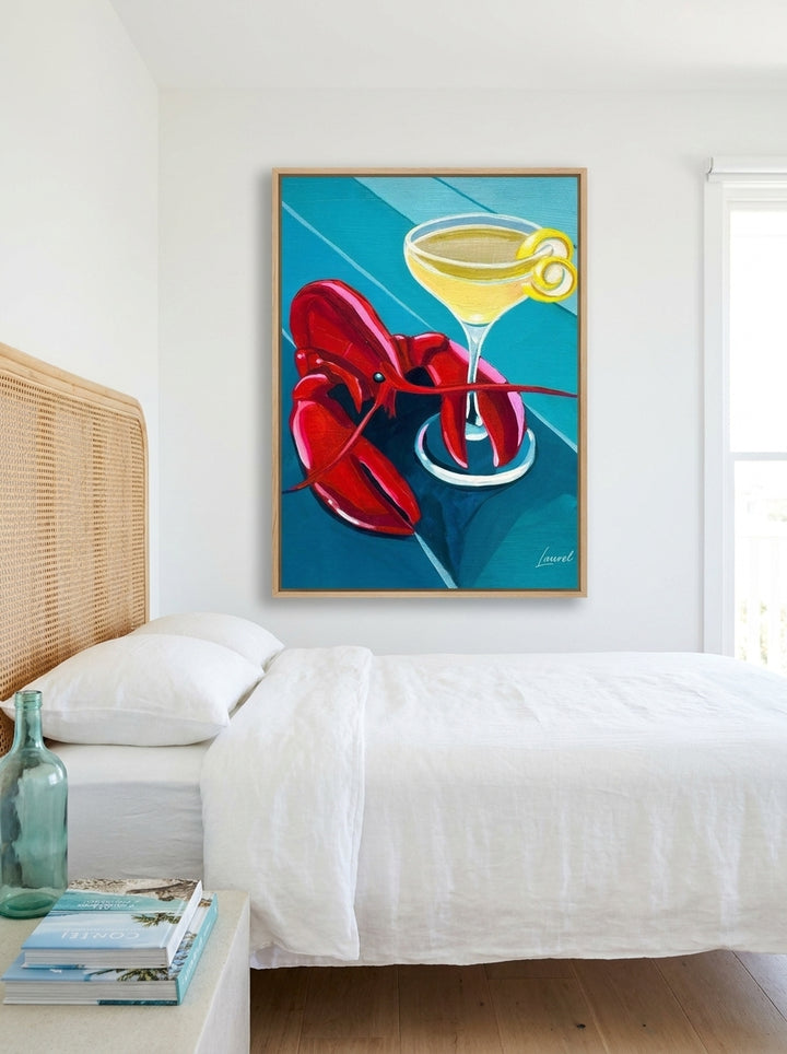 Oversized statement canvas wall art with a natural timber surround styled on the wall in a coastal bedroom