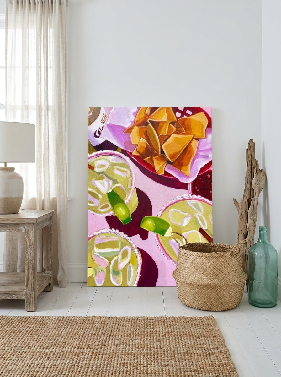 Stretched canvas wall art leaning against the wall in a coastal living room