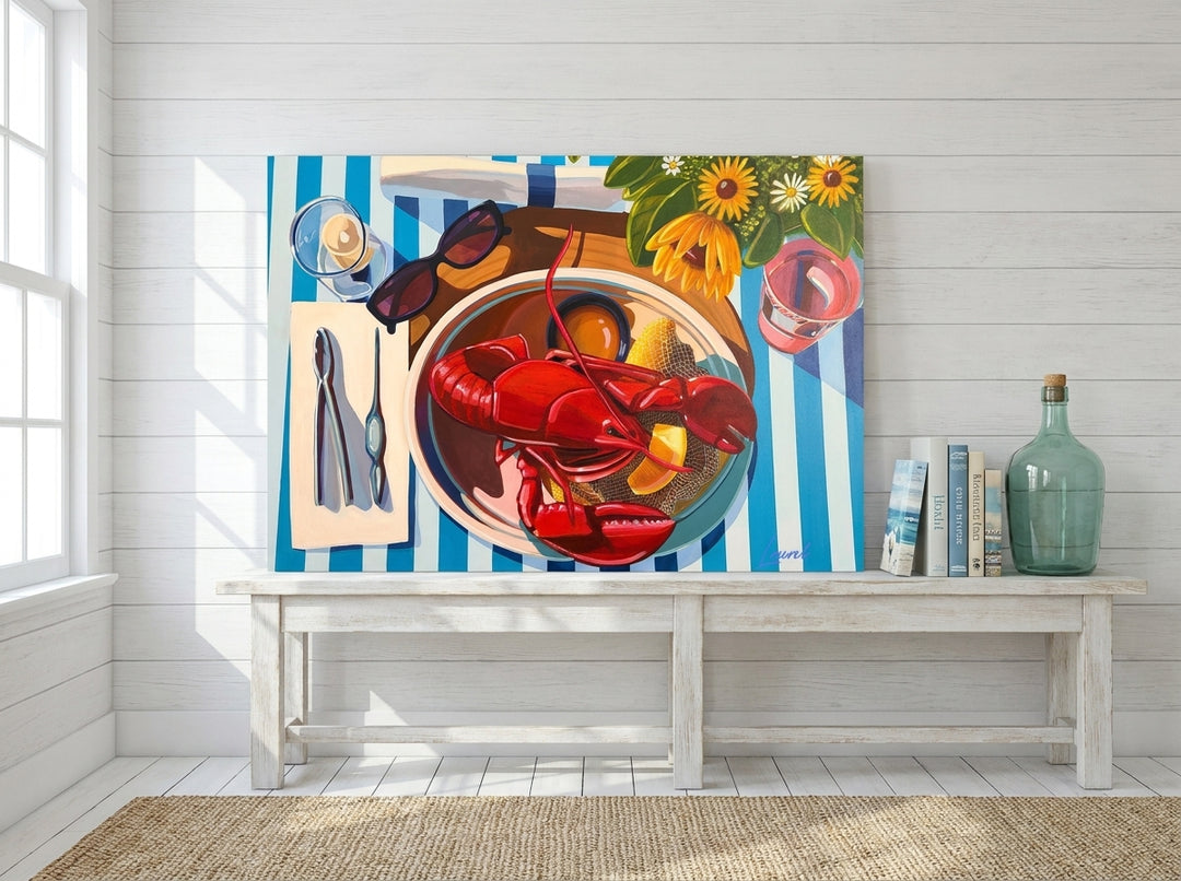 Stretched canvas wall art standing on a console in a coastal dining room
