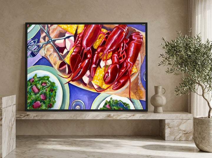 Modern wall art print standing on a kitchen bench in a luxe kitchen