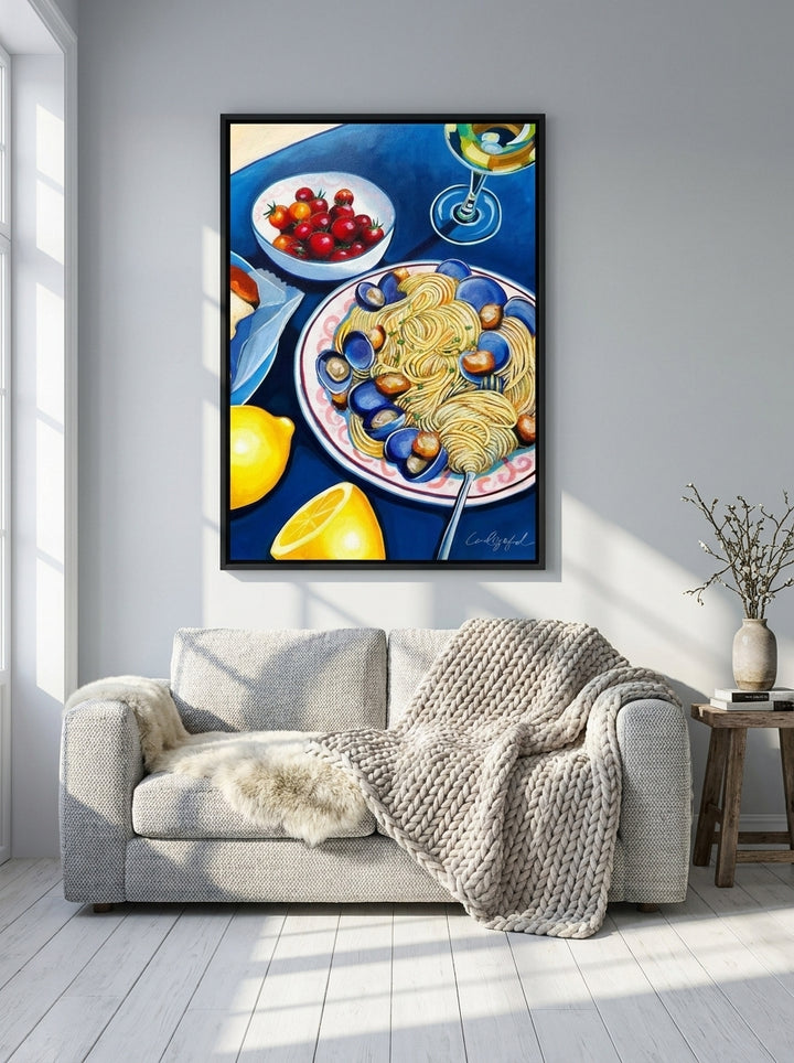 Canvas wall art with a black surround styled on the wall in a bright Scandinavian living room