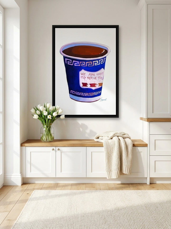 Canvas wall art with a black surround styled on the wall in a bright Scandinavian kitchen