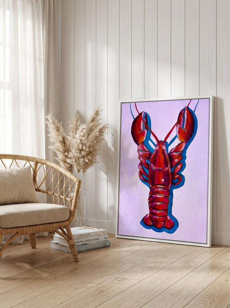 Oversized statement canvas wall art with a white surround leaning against the wall in a coastal bedroom