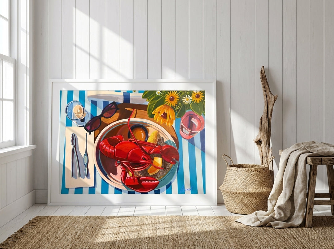 Oversized statement modern wall art print leaning against the wall in a coastal bedroom