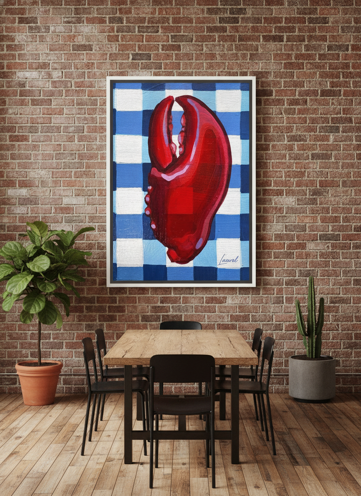 Oversized statement canvas wall art with a white surround styled on the wall in an industrial loft dining room