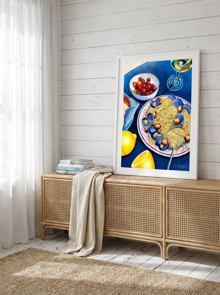 Modern wall art print standing on a sideboard in a coastal living room