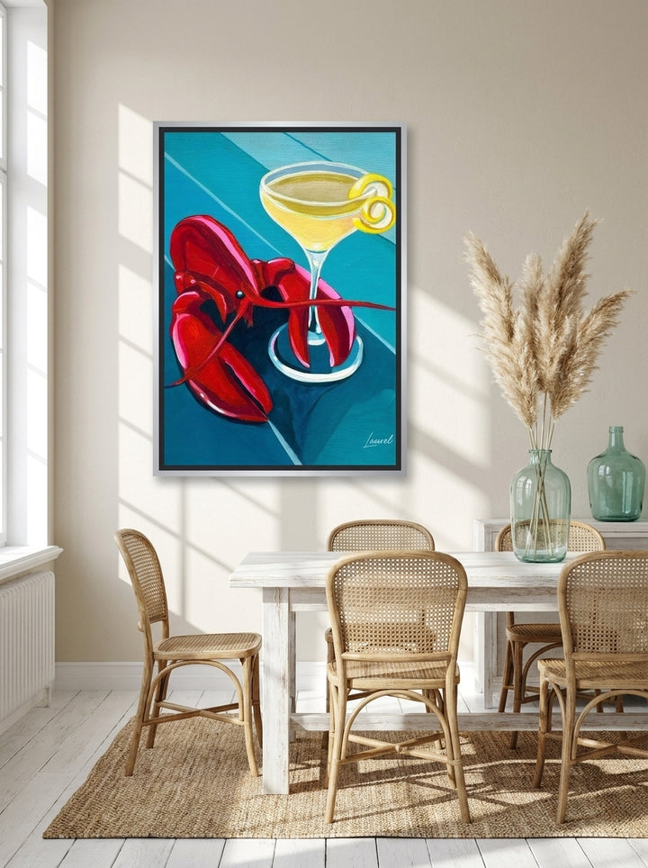 Canvas wall art with a silver leaf surround styled on the wall in a coastal dining room