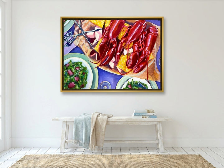Canvas wall art with a gold leaf surround styled on the wall in a coastal living room