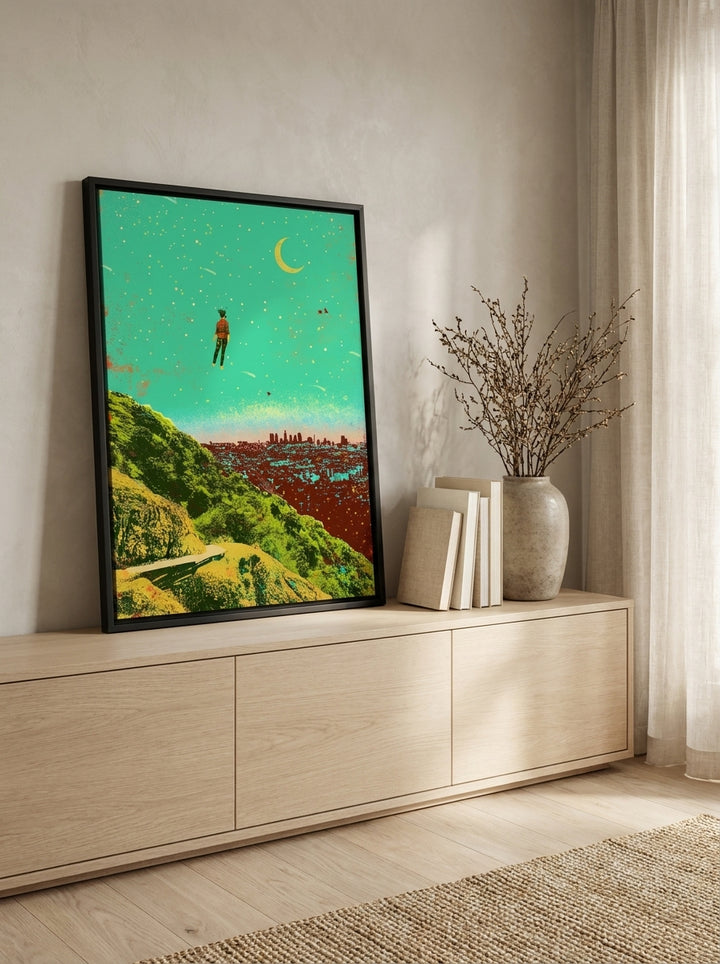Canvas wall art with a black surround standing on a sideboard in a warm Japandi bedroom
