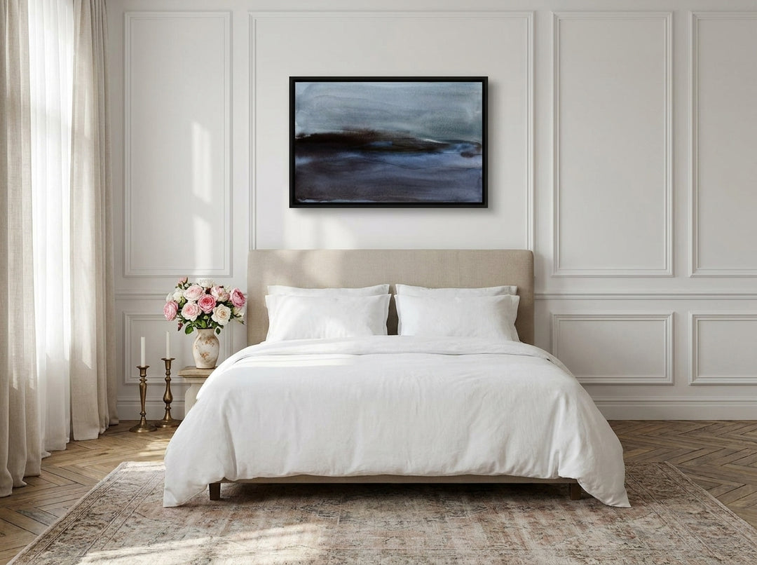 Canvas wall art with a black surround styled on the wall in a Parisian bedroom