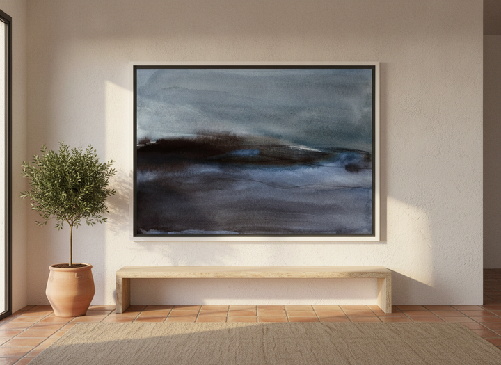 Oversized statement canvas wall art with a white surround styled on the wall in a Mediterranean living room