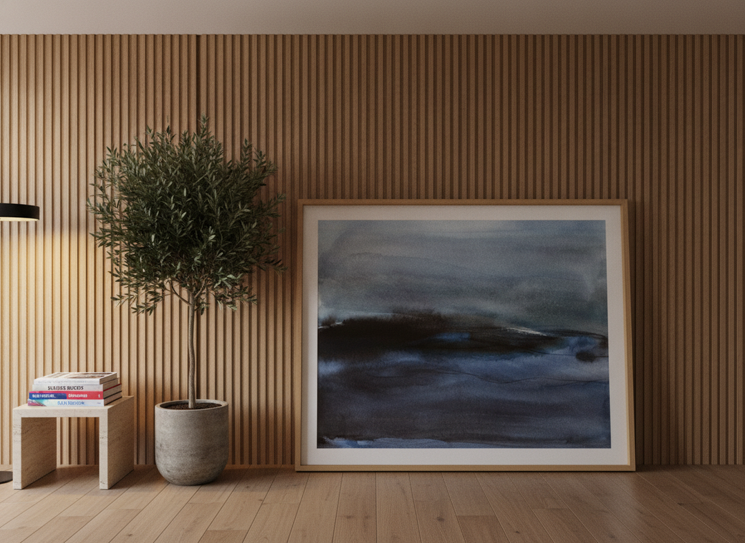 Oversized statement modern wall art print leaning against the wall in a luxe living room