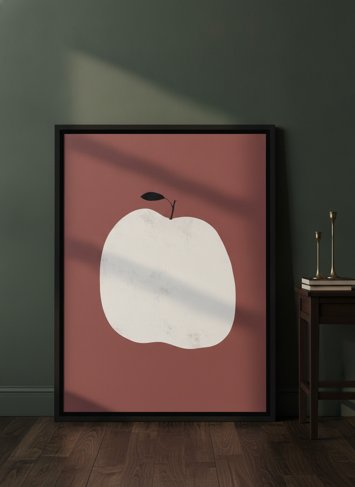 Canvas wall art with a black surround leaning against the wall in a moody living room