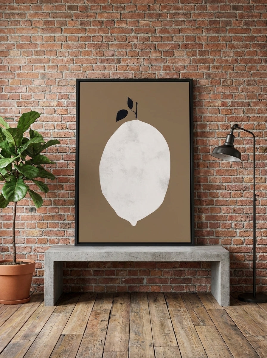 Canvas wall art with a black surround standing on a kitchen bench in an industrial loft kitchen