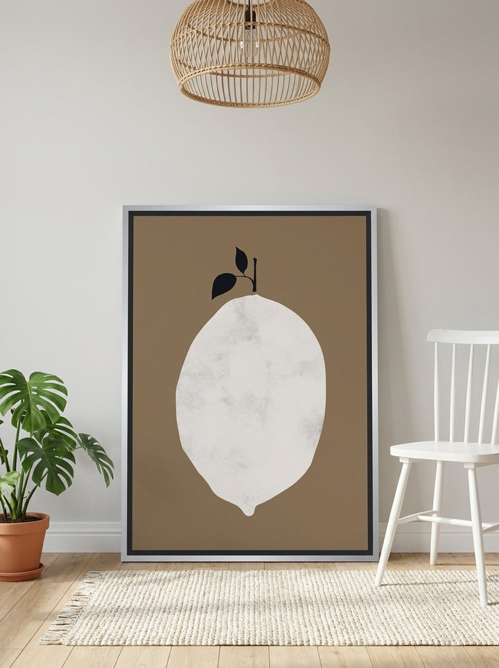 Canvas wall art with a silver leaf surround leaning against the wall in a bright Scandinavian bathroom