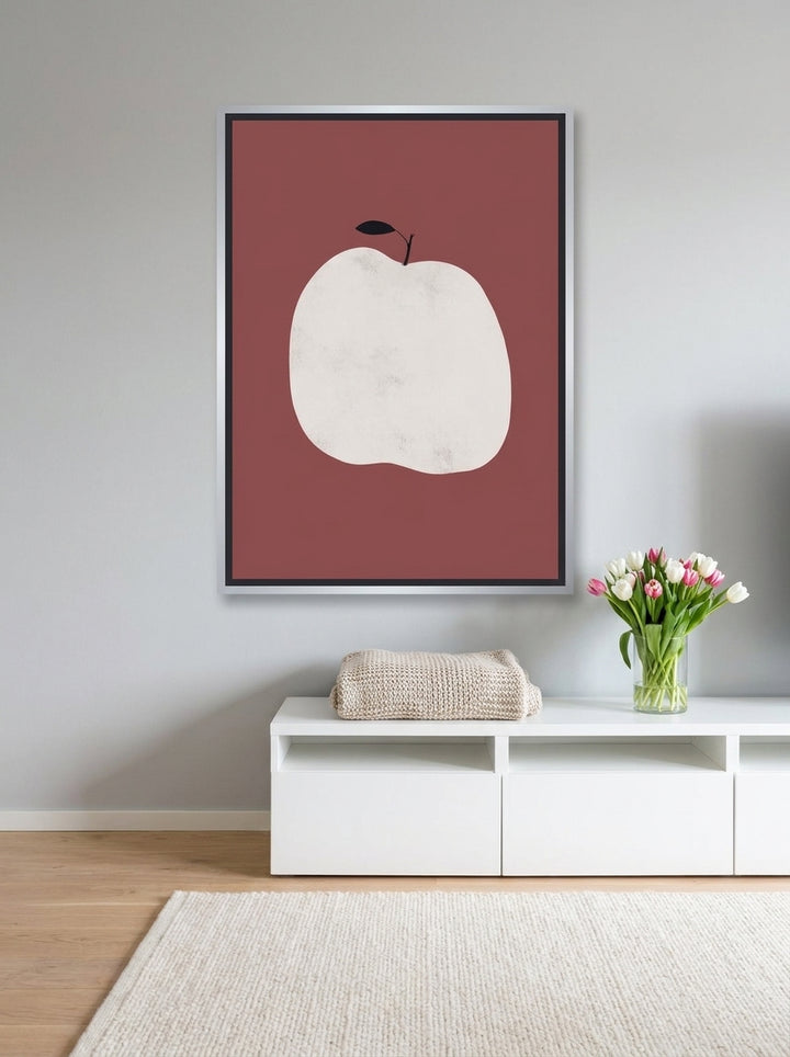 Canvas wall art with a silver leaf surround styled on the wall in a bright Scandinavian living room