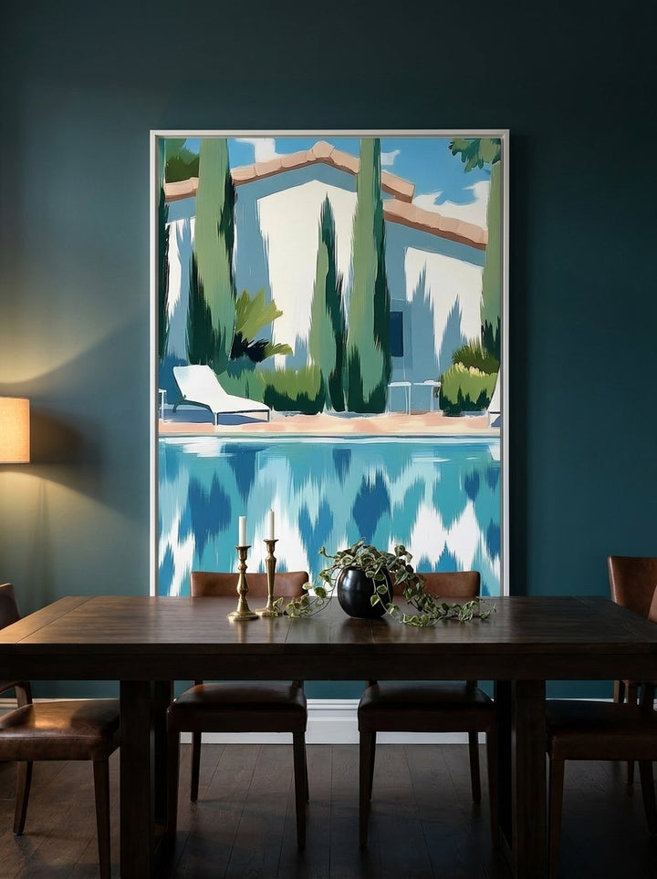 Oversized statement canvas wall art with a white surround styled on the wall in a moody dining room