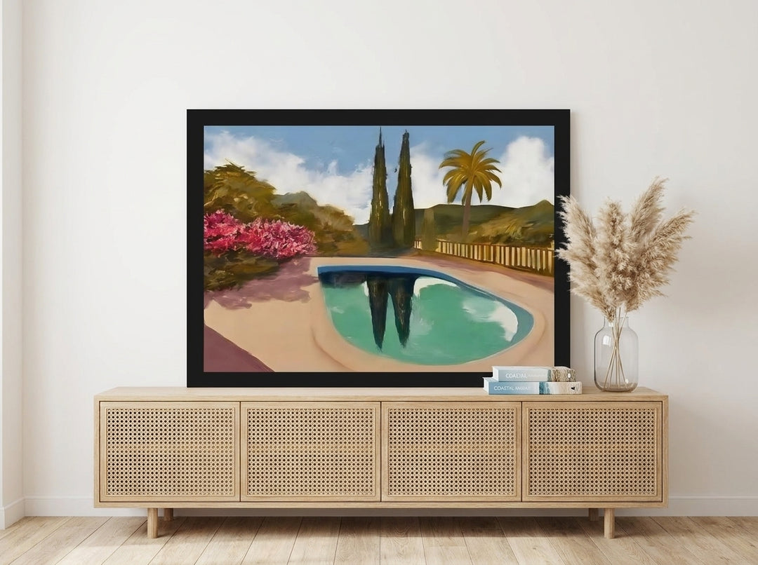 Modern wall art print standing on a sideboard in a coastal bedroom