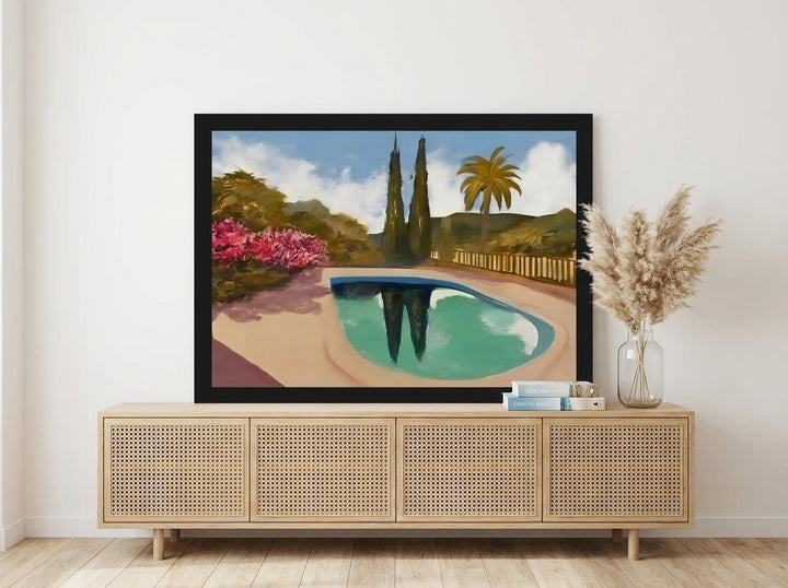 Modern wall art print standing on a sideboard in a coastal bedroom