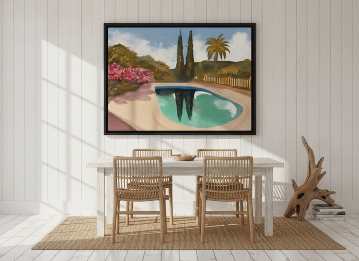Canvas wall art with a black surround styled on the wall in a coastal dining room