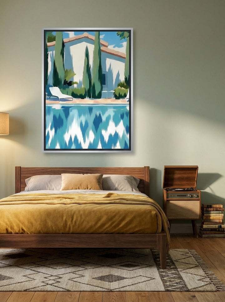 Canvas wall art with a silver leaf surround styled on the wall in a mid-century bedroom