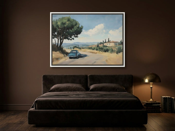 Canvas wall art with a white surround styled on the wall in a moody bedroom