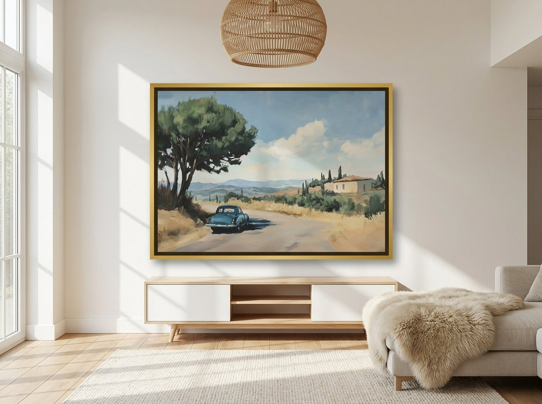 Oversized statement canvas wall art with a gold leaf surround styled on the wall in a bright Scandinavian living room