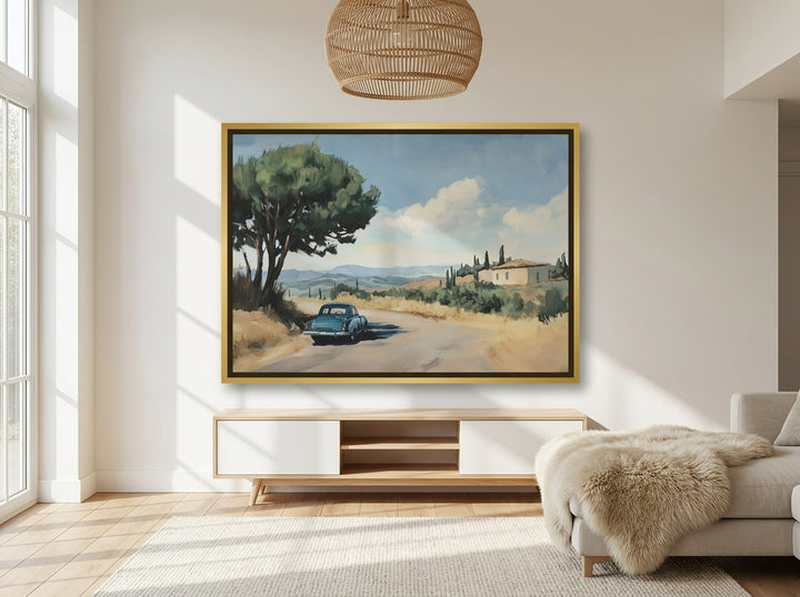 Oversized statement canvas wall art with a gold leaf surround styled on the wall in a bright Scandinavian living room