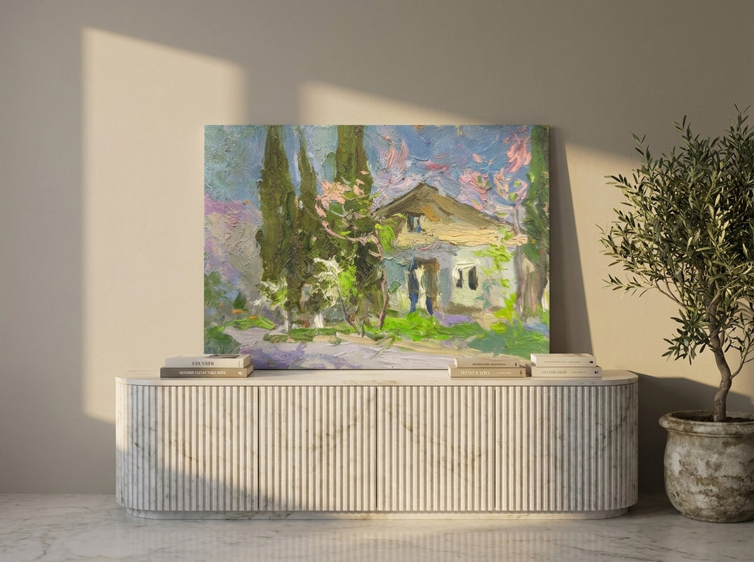 Stretched canvas wall art standing on a sideboard in a luxe home office