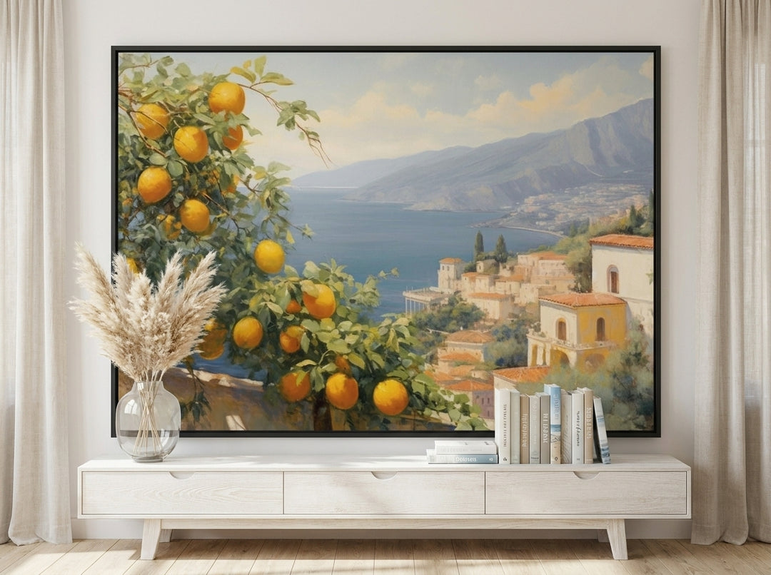Oversized statement canvas wall art with a black surround styled on the wall in a coastal living room