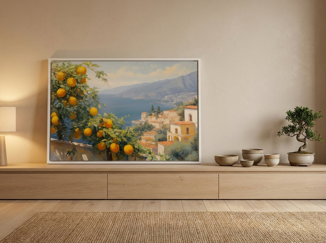 Canvas wall art with a white surround standing on a sideboard in a warm Japandi bedroom
