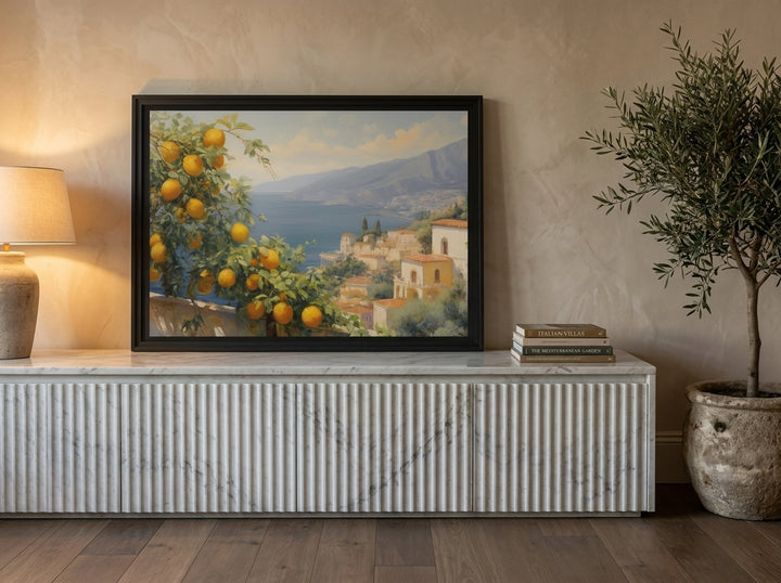 Modern wall art print standing on a sideboard in a luxe bedroom