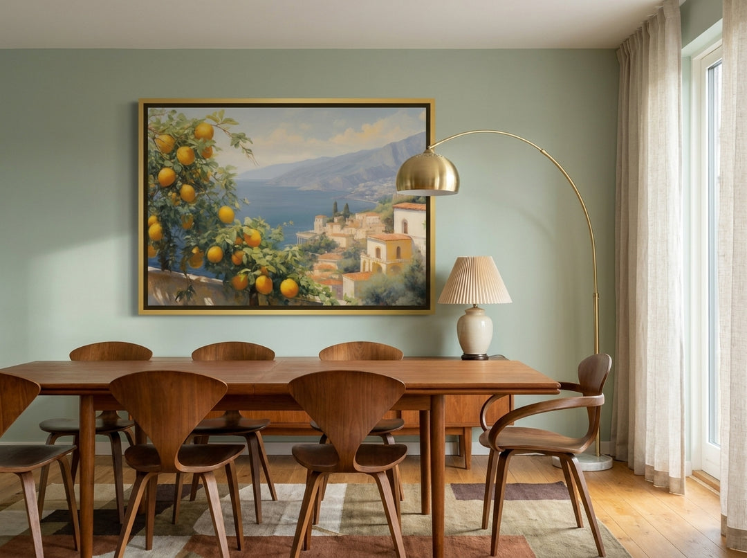 Oversized statement canvas wall art with a gold leaf surround styled on the wall in a mid-century dining room