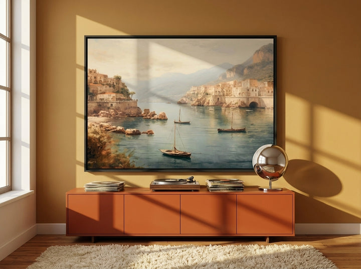 Oversized statement canvas wall art with a black surround styled on the wall in a retro 70s living room