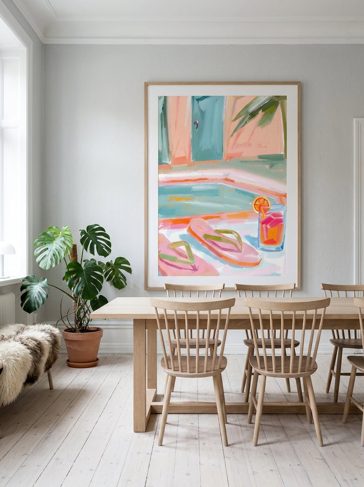 Oversized statement modern wall art print styled on the wall in a bright Scandinavian dining room