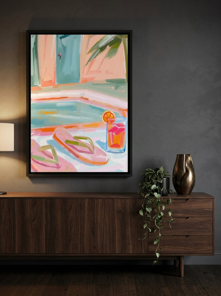 Canvas wall art with a black surround styled on the wall in a moody living room