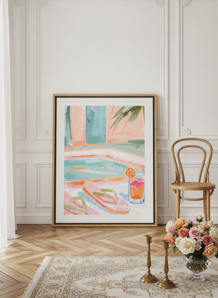 Oversized statement canvas wall art with a natural timber surround leaning against the wall in a Parisian dining room