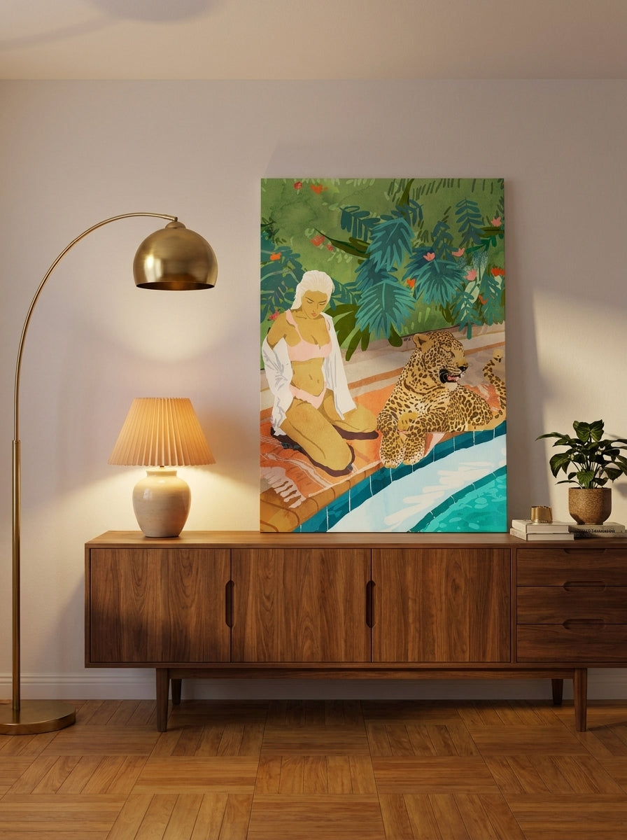 Stretched canvas wall art standing on a sideboard in a mid-century bedroom