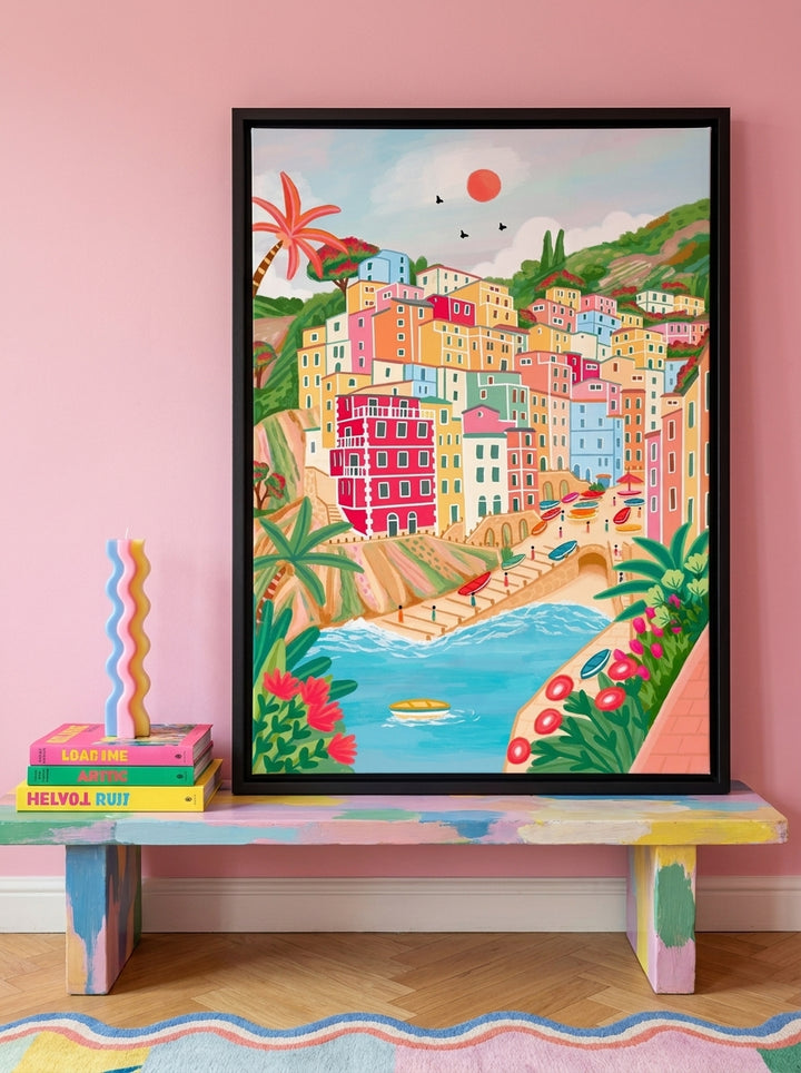Canvas wall art with a black surround standing on a side table in a colourful eclectic dining room