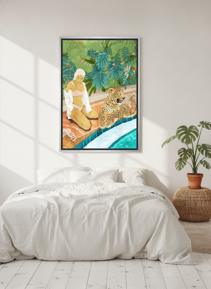 Canvas wall art with a silver leaf surround styled on the wall in a bright Scandinavian bedroom