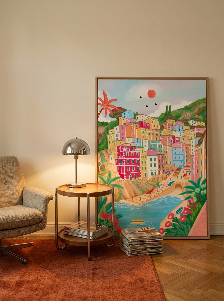 Oversized statement canvas wall art with a natural timber surround leaning against the wall in a retro 70s dining room