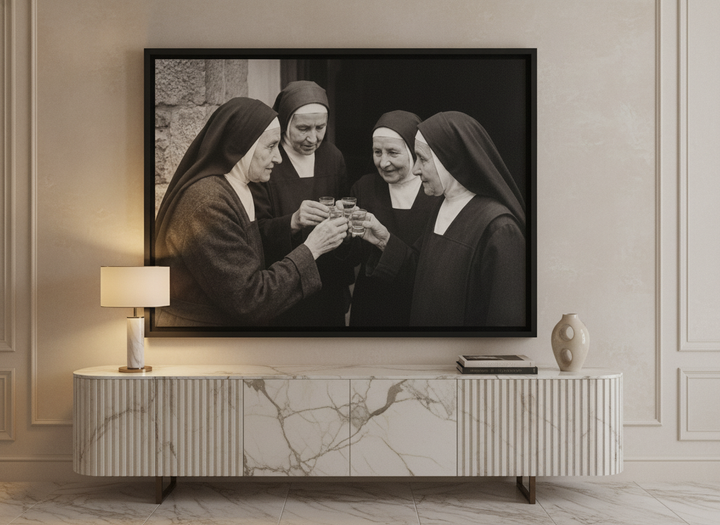 Canvas wall art with a black surround standing on a sideboard in a luxe living room