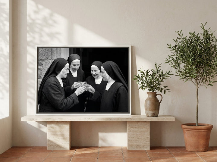Canvas wall art with a white surround standing on a console in a Mediterranean bedroom
