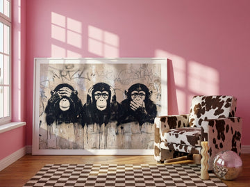 Oversized statement modern wall art print leaning against the wall in a colourful eclectic bedroom