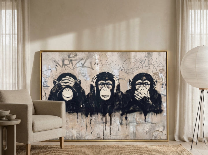 Canvas wall art with a gold leaf surround leaning against the wall in a warm Japandi home office