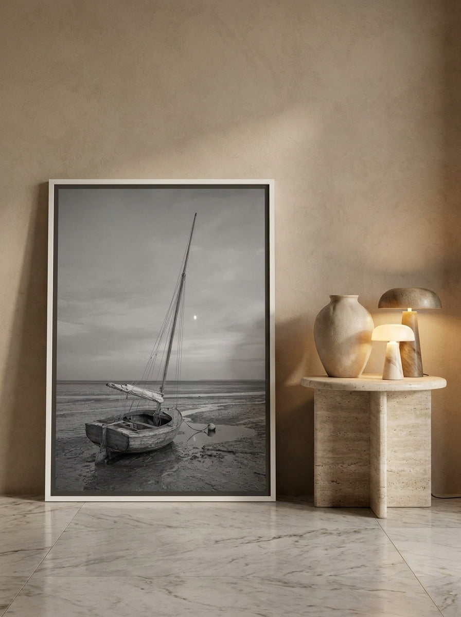 Canvas wall art with a white surround leaning against the wall in a luxe bedroom